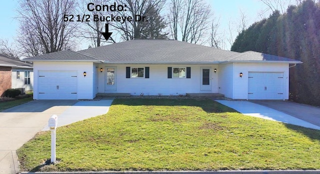 ranch-style house featuring a front yard, a garage, and concrete driveway