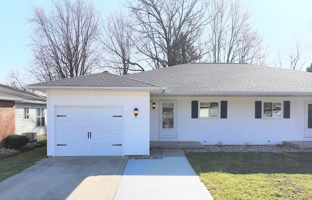 ranch-style home featuring driveway, an attached garage, a front lawn, and roof with shingles