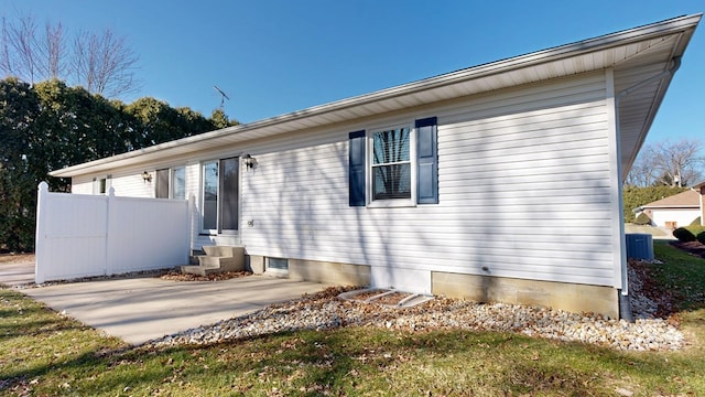 view of front of home with central air condition unit and entry steps