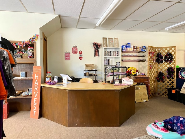 carpeted office featuring a drop ceiling