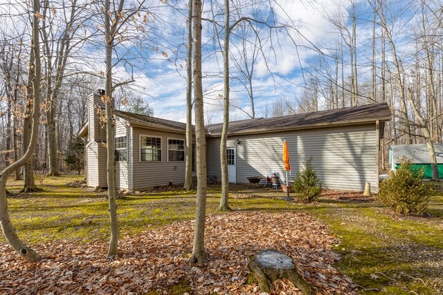 7326 State Route 19 Unit U8 L264-265, Mount Gilead, OH 43338 - back of house featuring a chimney