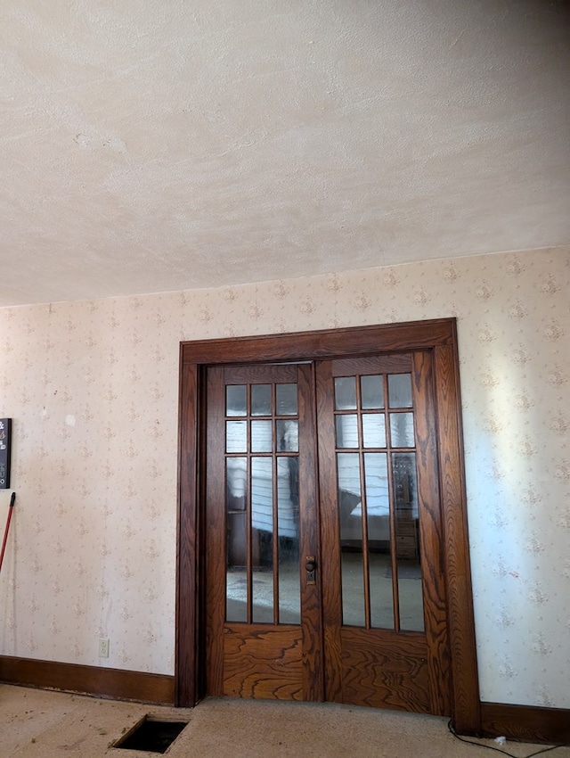 room details featuring carpet and a textured ceiling