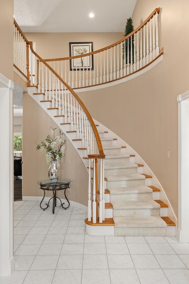 2313 Woodland Park Dr, Ontario, OH 44903 - stairway featuring a high ceiling and recessed lighting