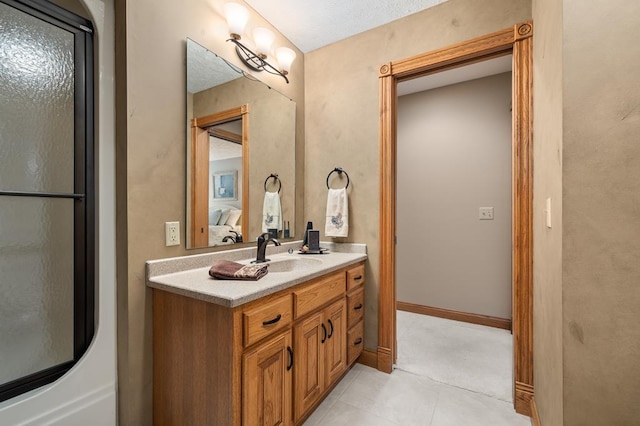 2313 Woodland Park Dr, Ontario, OH 44903 - ensuite bathroom featuring vanity and tile patterned flooring