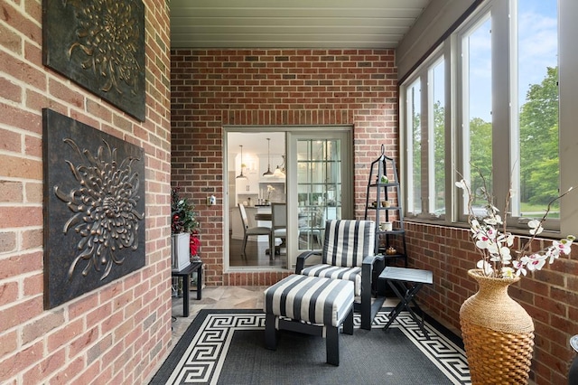 2313 Woodland Park Dr, Ontario, OH 44903 - sunroom featuring brick wall and plenty of natural light