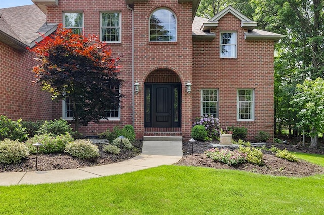 2313 Woodland Park Dr, Ontario, OH 44903 - view of front of property with a front yard and brick siding