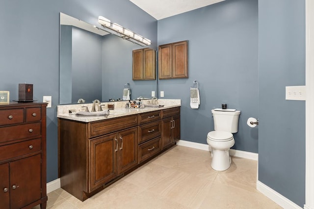 2313 Woodland Park Dr, Ontario, OH 44903 - bathroom with double vanity and baseboards