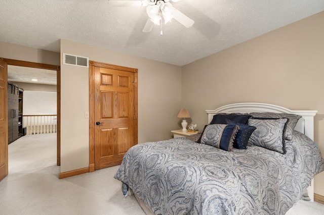 2313 Woodland Park Dr, Ontario, OH 44903 - bedroom featuring light carpet, a textured ceiling, and ceiling fan