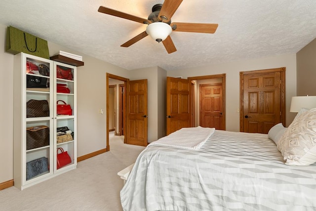 2313 Woodland Park Dr, Ontario, OH 44903 - bedroom featuring light carpet, a textured ceiling, and ceiling fan