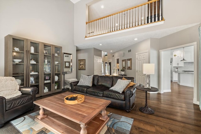 2313 Woodland Park Dr, Ontario, OH 44903 - living room with wood finished floors, a towering ceiling, and recessed lighting