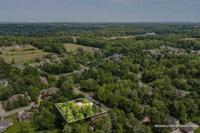 2313 Woodland Park Dr, Ontario, OH 44903 - aerial view of property and surrounding area featuring a forest and property parcel outlined