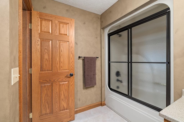 2313 Woodland Park Dr, Ontario, OH 44903 - full bath with enclosed tub / shower combo, tile patterned floors, and a textured ceiling