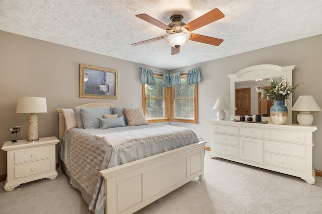 2313 Woodland Park Dr, Ontario, OH 44903 - bedroom featuring light colored carpet, a textured ceiling, and a ceiling fan