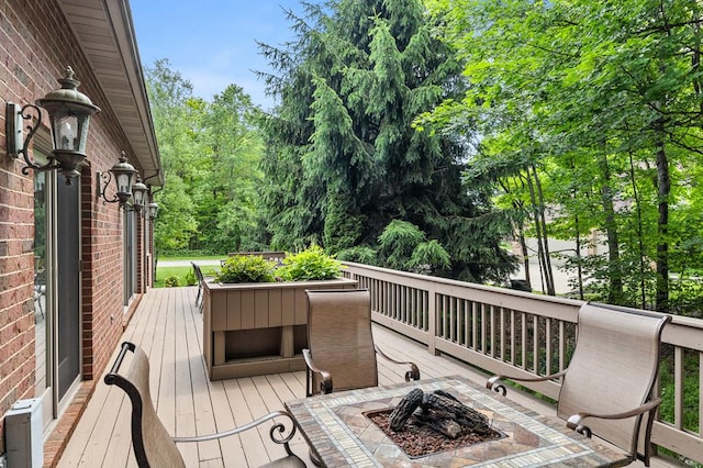 2313 Woodland Park Dr, Ontario, OH 44903 - wooden terrace with a fire pit