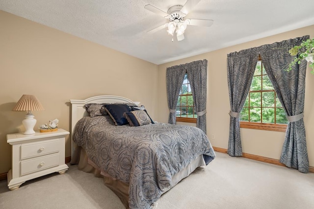2313 Woodland Park Dr, Ontario, OH 44903 - bedroom with multiple windows, light carpet, and ceiling fan