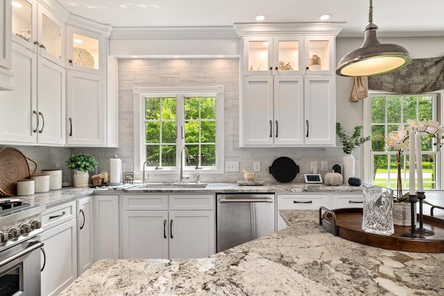 2313 Woodland Park Dr, Ontario, OH 44903 - kitchen with stainless steel appliances, white cabinetry, backsplash, ornamental molding, and recessed lighting