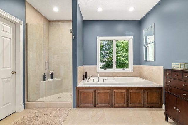 2313 Woodland Park Dr, Ontario, OH 44903 - bathroom with a shower stall, a garden tub, tile patterned flooring, recessed lighting, and vanity