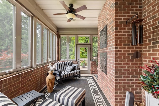 2313 Woodland Park Dr, Ontario, OH 44903 - sunroom featuring plenty of natural light, ceiling fan, and a fireplace
