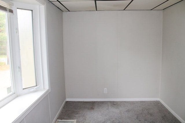 unfurnished room with carpet and plenty of natural light