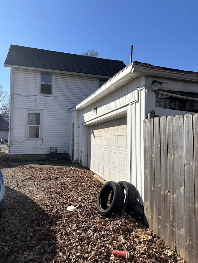 view of side of property with a garage