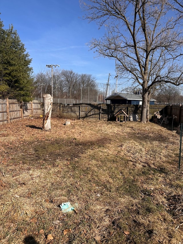 view of yard with a fenced backyard