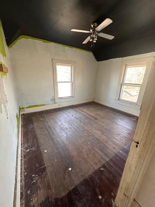 interior space featuring ceiling fan, lofted ceiling, and wood-type flooring