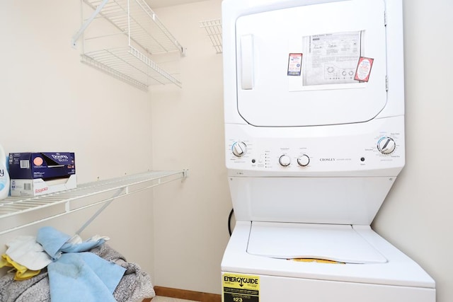 laundry room featuring laundry area and stacked washer / dryer