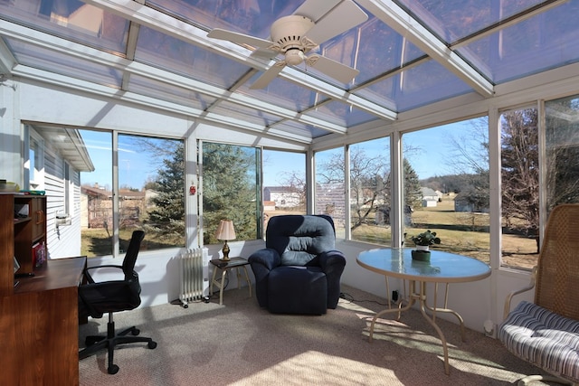 sunroom / solarium with radiator, coffered ceiling, and ceiling fan