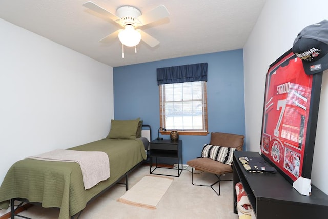 carpeted bedroom featuring a ceiling fan