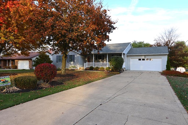 single story home with a garage, a porch, and concrete driveway