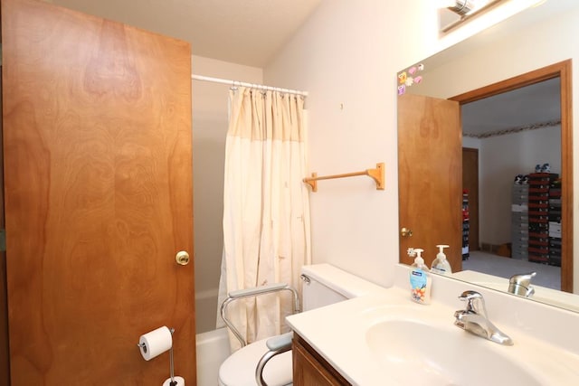 bathroom featuring vanity, toilet, and shower / bath combo with shower curtain