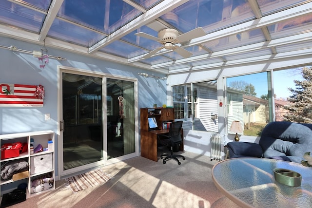 sunroom / solarium with coffered ceiling, ceiling fan, and radiator heating unit