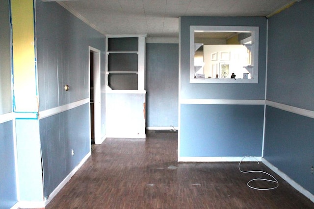 spare room with dark wood-type flooring