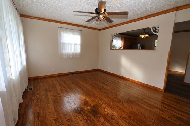 empty room featuring ceiling fan with notable chandelier, a textured ceiling, dark hardwood / wood-style flooring, and crown molding