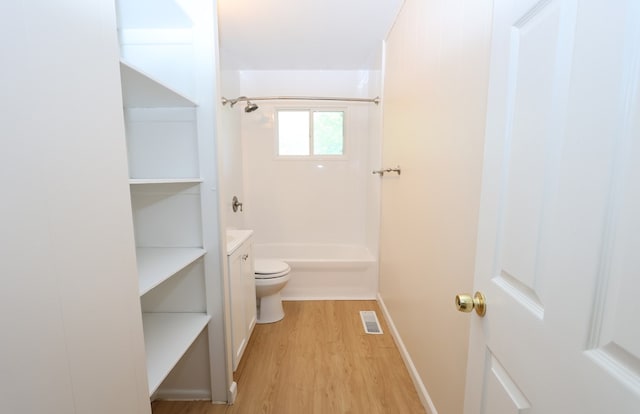 bathroom featuring hardwood / wood-style floors, vanity, and toilet