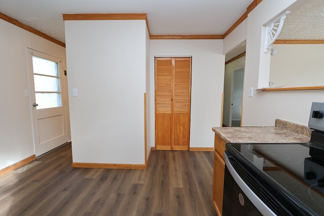 kitchen with black / electric stove, crown molding, and dark wood-type flooring