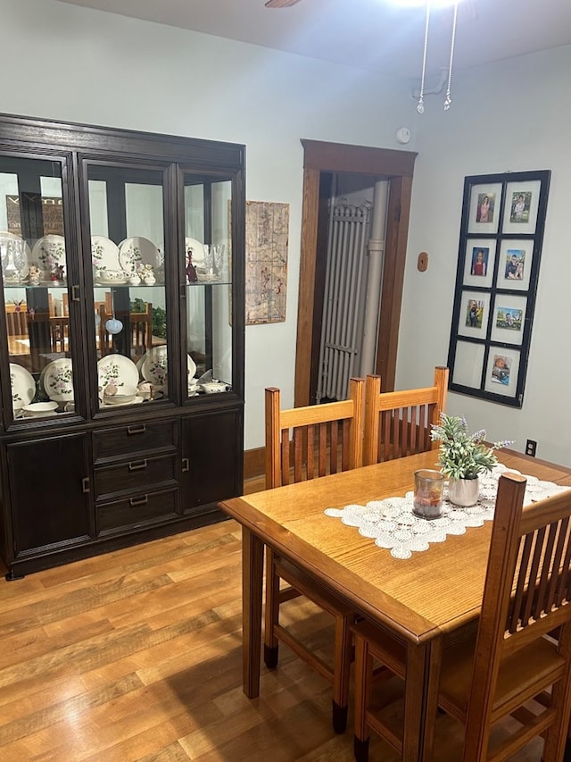 dining space with light hardwood / wood-style flooring