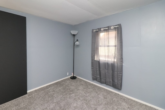 empty room featuring carpet flooring