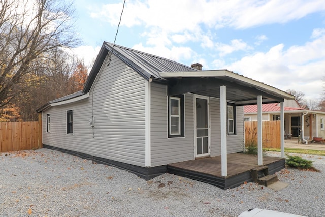 exterior space featuring a wooden deck