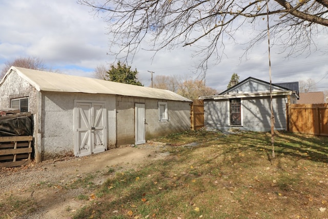 view of outbuilding with a yard