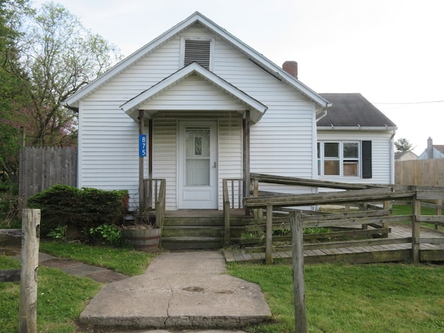 875 E Walnut St, Galion, OH 44833 - view of front of property with a chimney and fence