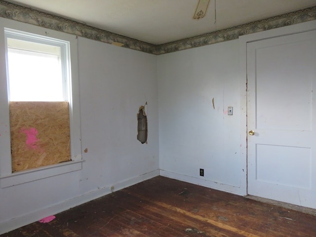 875 E Walnut St, Galion, OH 44833 - spare room featuring hardwood / wood-style flooring and baseboards