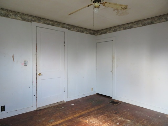 875 E Walnut St, Galion, OH 44833 - empty room with hardwood / wood-style flooring and a ceiling fan