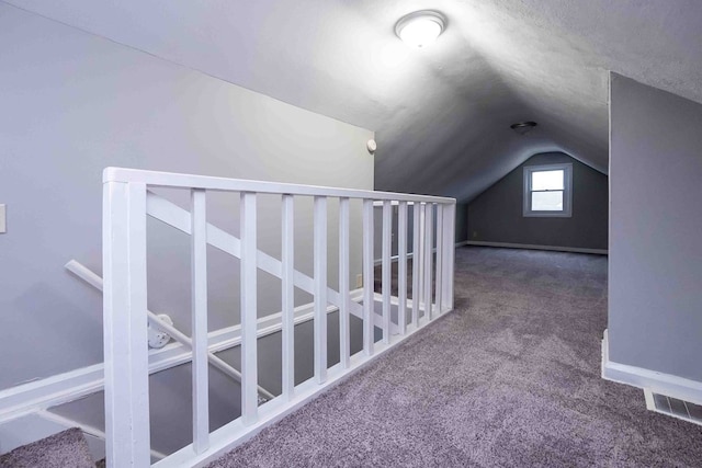 additional living space featuring carpet and lofted ceiling