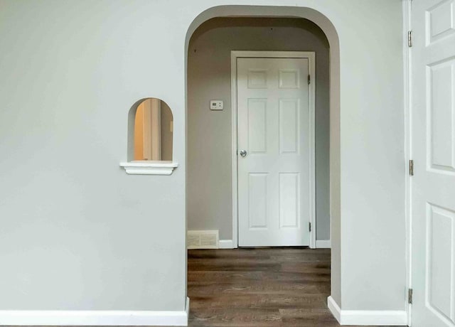 hallway featuring dark wood-type flooring