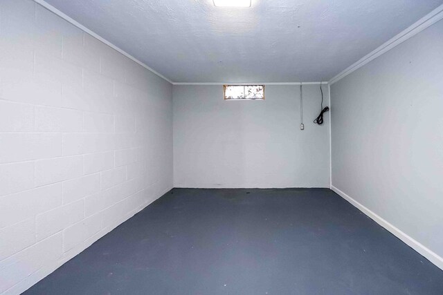 basement featuring a textured ceiling