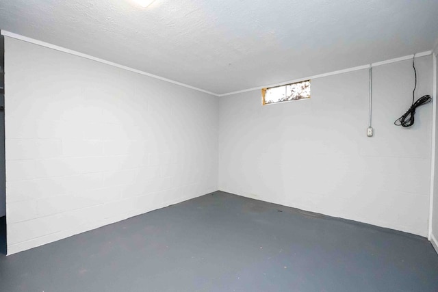 basement featuring a textured ceiling