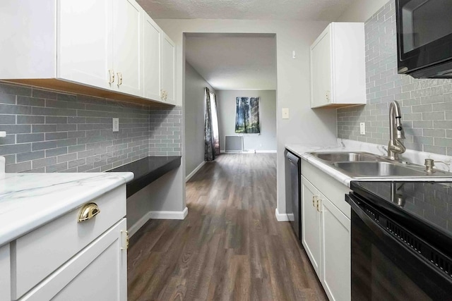 kitchen with sink, dark hardwood / wood-style flooring, decorative backsplash, white cabinets, and black appliances