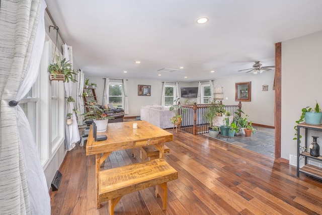 dining area featuring dark wood-type flooring