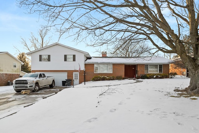 split level home with a garage